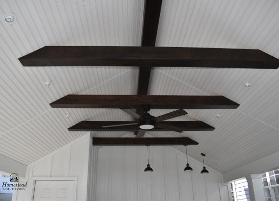 Beaded vinyl ceiling with etchwood beams