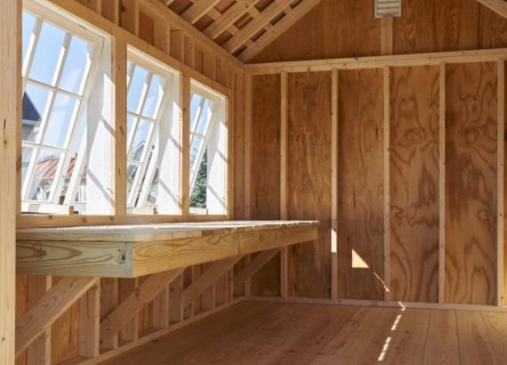 Premier Garden Shed interior with potting bench and skylight