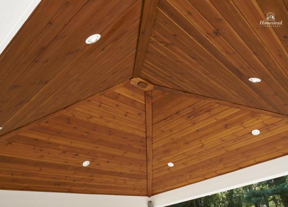 Stained T&G pine ceiling with recessed lighting