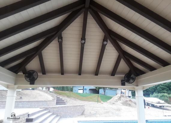 Stained timber frame rafters with white wash T&G pine roof boards
