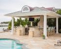 Custom vintage backyard pavilion with full outdoor kitchen