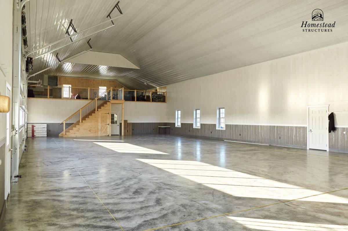 Inside view of a custom 2 car garage with a second story from Homestead Structures